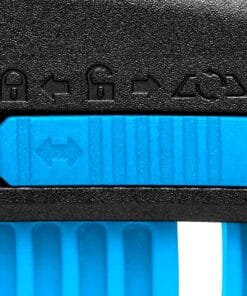 szczegółowy widok mechanizmu blokady narzędzia, z zielonym przyciskiem do odblokowywania oraz ikonami przedstawiającymi różne stany (zablokowane, odblokowane), co jest istotne dla bezpiecznego użytkowania narzędzi w pracach budowlanych i ekologicznych.